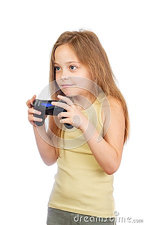 Young excited cute girl with grey blue eyes and long light brown hair plays computer game with joystick Stock Photo