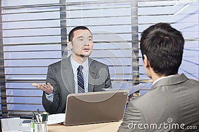 Young executive demanding explanation from his employee Stock Photo