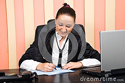 Young executive woman writing on papers Stock Photo