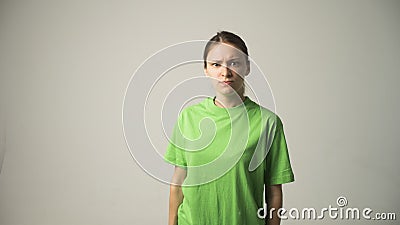 Anger and rage concept. Young expressive woman show her bad face. Angry nervous annoyed girl portrait. Human full of negative emot Stock Photo