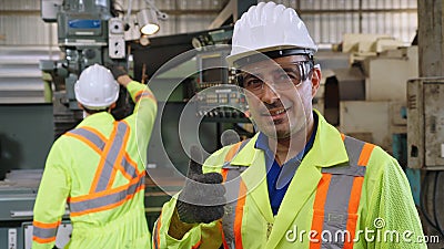 Young factory worker or engineer close up portrait in factory Stock Photo