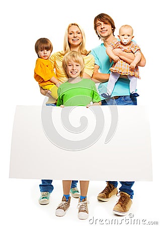 Young family with blank advertising banner Stock Photo