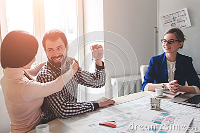 Young family couple purchase rent property real estate . Agent giving consultation to man and woman. Signing contract Stock Photo