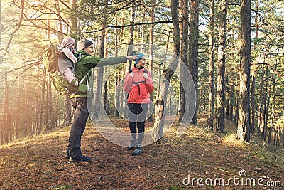 Young family on forest hike on sunny autumn day Stock Photo