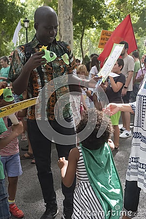 A young family during Green Tide demonstration, Madrid Spain Editorial Stock Photo