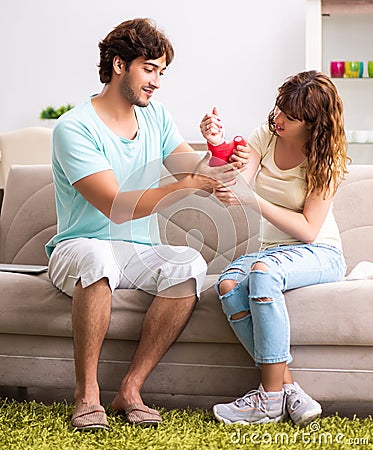 Young family helping each other after injury Stock Photo