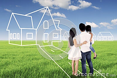 Young family looking at their dream house Stock Photo