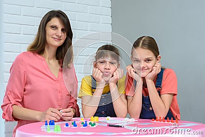 Young family plays board games and looked into the frame Stock Photo