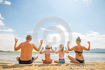 A young family is sitting in a contemplative stance Stock Photo