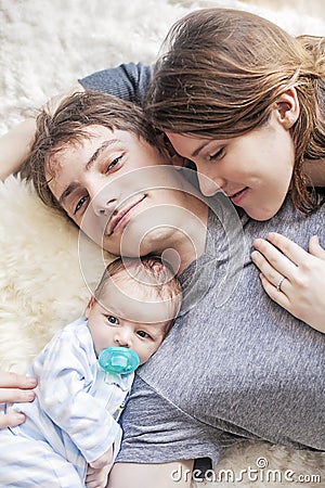 Young family snuggling Stock Photo