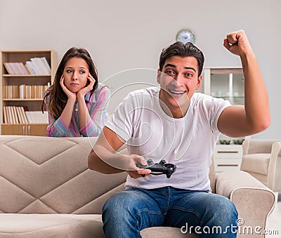 Young family suffering from computer games addiction Stock Photo