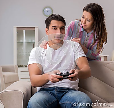 Young family suffering from computer games addiction Stock Photo