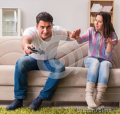 Young family suffering from computer games addiction Stock Photo