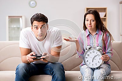 The young family suffering from computer games addiction Stock Photo