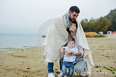 Young family together in nature with a little boy Stock Photo