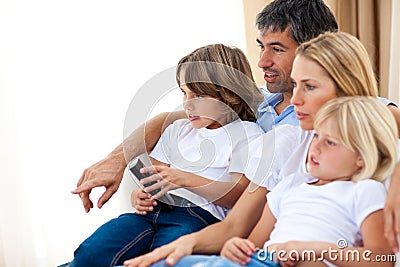 Young Family watching TV Stock Photo