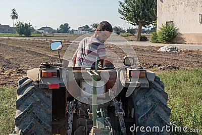 Young farmer preparing the farm tools to start the cultivation of the orchard Stock Photo