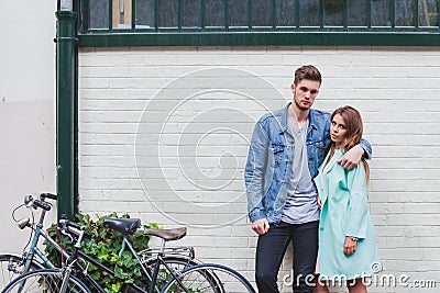 Young fashion caucasian couple looking at camera Stock Photo