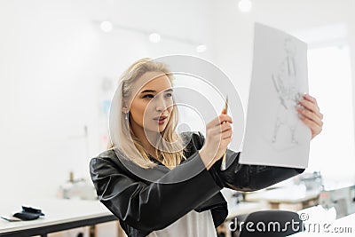 young fashion designer measuring proportions of Stock Photo