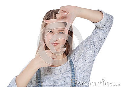 Young fashion girl looking through hands frame isolated Stock Photo
