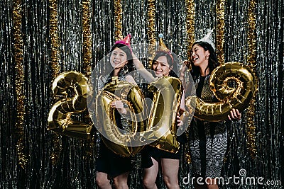 Friends dancing with 2019 gold balloons Stock Photo