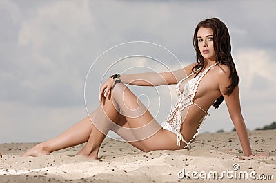 Young fashion pretty woman on the beach Stock Photo