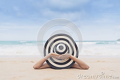 Young fashion woman relax on the beach. Happy island lifestyle. White sand, blue cloudy sky and crystal sea of tropical beach Stock Photo