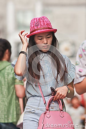 Young fashionable Chinese girl with a pink hat, Beijing, China Editorial Stock Photo