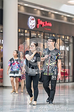 Young fashionable couple at Livat Shopping Mall, Beijing, China Editorial Stock Photo