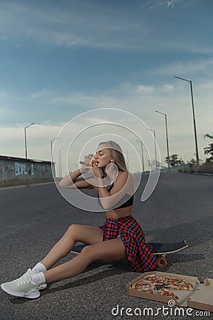 Young fashionable stylish model in summer hipster clothes. Cheerful, emotions. Stock Photo