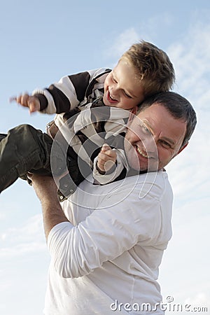 Young father playing with his son Stock Photo