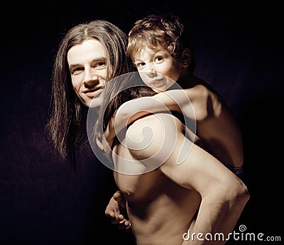 Young father with son hugging Stock Photo