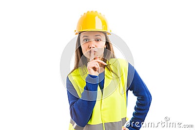 Young female architect making shush gesture Stock Photo