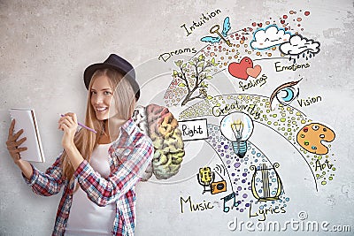 Young female artist with brain sketch Stock Photo