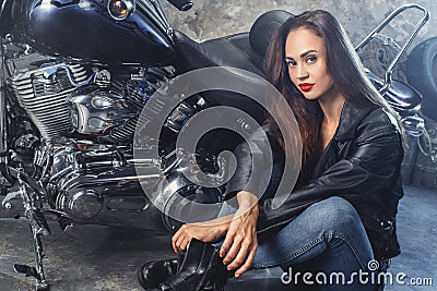 Young woman with motorcycle studio Stock Photo