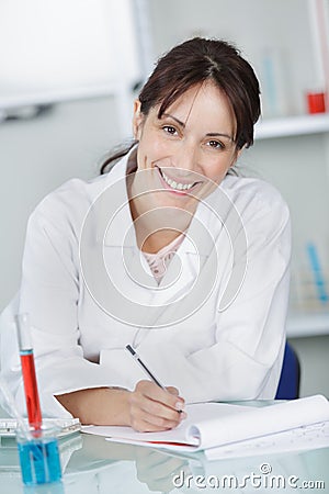 Young female biologist smiling at camera in hospital Stock Photo