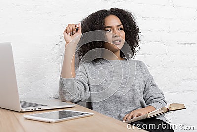 Young female blogger thinking about new ideas Stock Photo