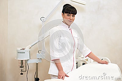 Young female cosmetologist before work Stock Photo