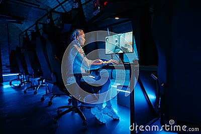 Young female cyber gamer, cosplayer plays computer games. Stock Photo