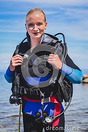 Young female diver outside Stock Photo