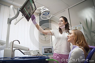 The patient and the dentist in the office on examination by a doctor Editorial Stock Photo