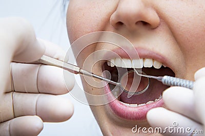 Young female having her teeth examined Stock Photo