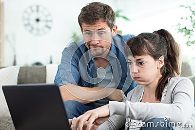 young female and unemployed husband with many debts Stock Photo