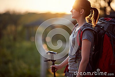 Young female hiker enjoying at sunrise in nature. healthy living, positive, nature concept Stock Photo