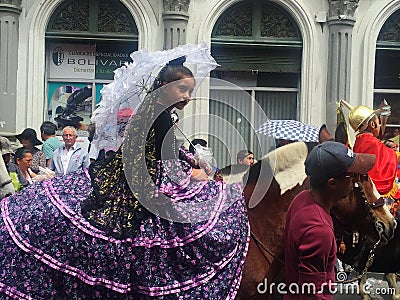 Little Girl in Purple Lace Dress Rides Horse in Christmas Parade in Cuenca Ecuador Editorial Stock Photo