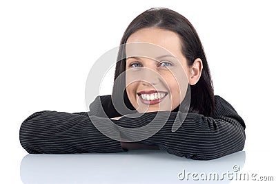 Young female lawyer legal professional relaxing with smile, arms folded on desk Stock Photo