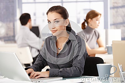 Young female in office colleagues working behind Stock Photo