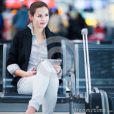 Young female passenger at the airport, Stock Photo