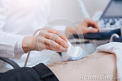 Young female practitioner providing appointment at the sonography cabinet Stock Photo