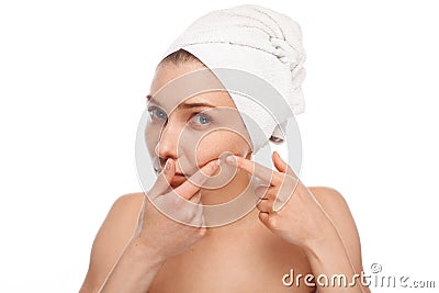 Young female after shower popping pimple Stock Photo